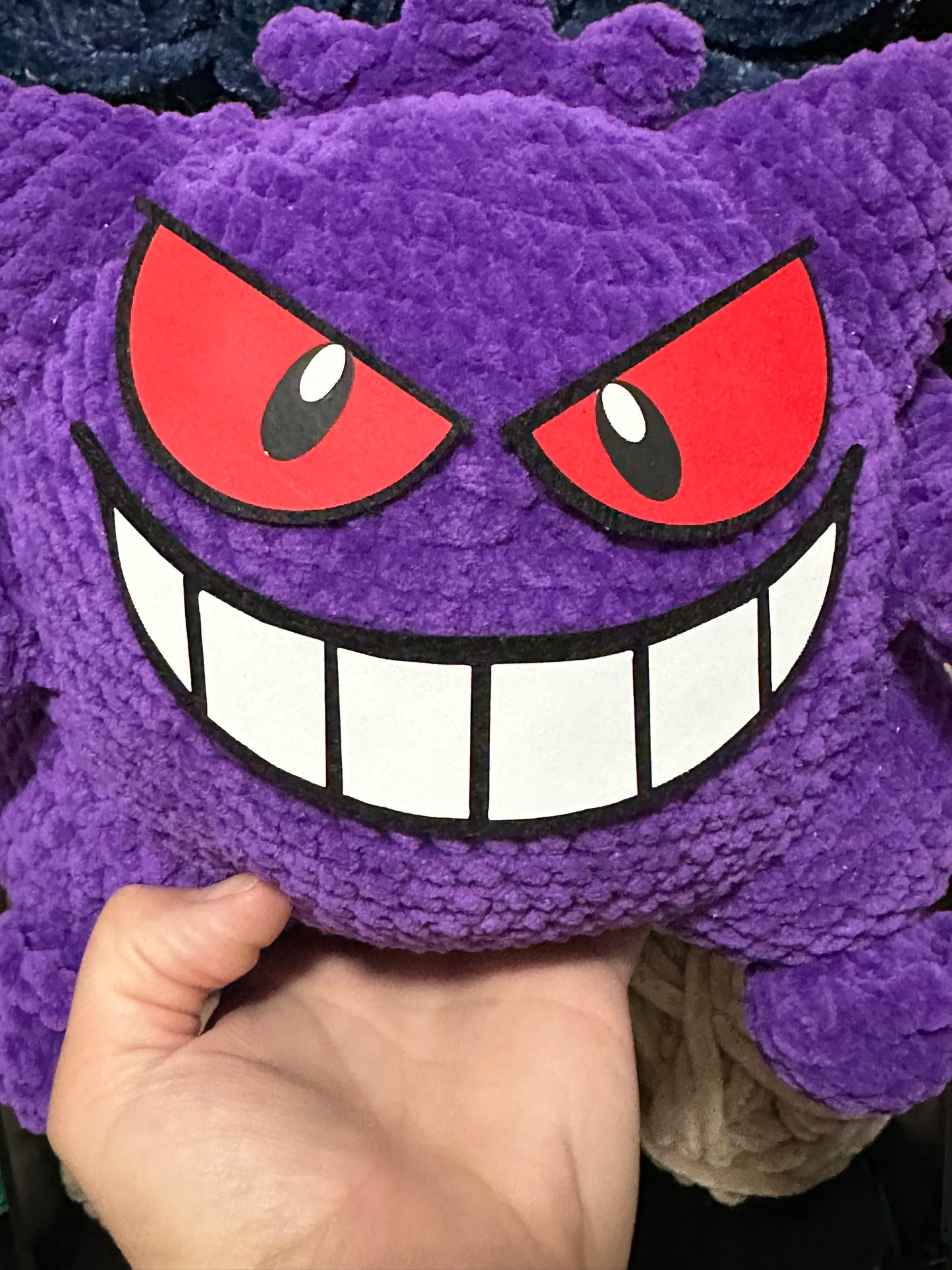 Gengar inspired felt face for Premier Parfait Chunky yarn