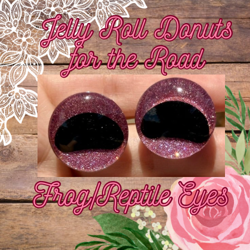 Two glittery safety eyes resembling eyes with black pupils, labeled "Jelly Roll Donuts for the Road" and "Frog/Reptile Eyes," set against a floral and wood background.