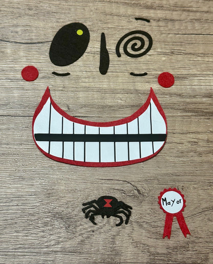 Character felt face appliqué with heat-activated backing