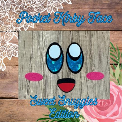A felt face of Kirby with blue eyes and pink accents on a wooden background, titled 'Pocket Kirby Face' and 'Sweet Snuggles Edition'.
